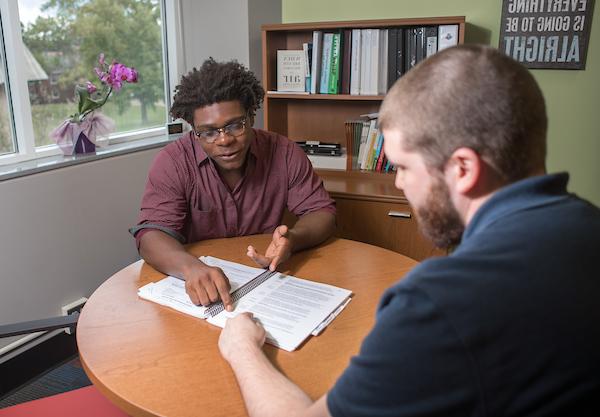 Staff reviewing handbook